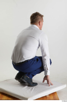  Steve Q  1 black oxford shoes blue trousers business dressed kneeling white shirt whole body 0006.jpg